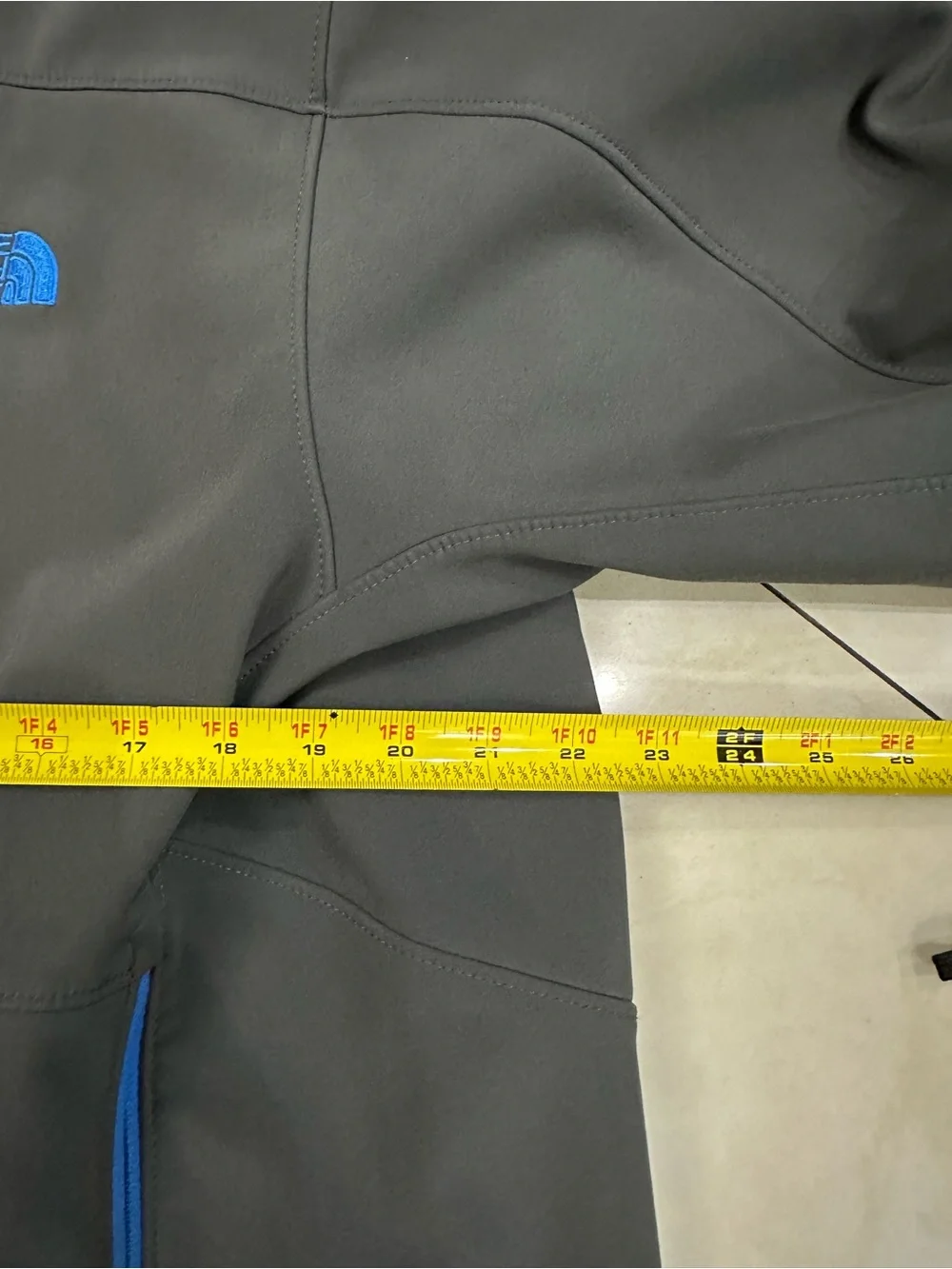 The North Face Men's Charcoal Gray Jacket with Blue Zippers